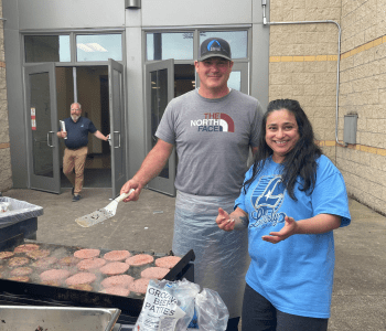 Jason grilling burgers for Liberty High School's graduating seniors